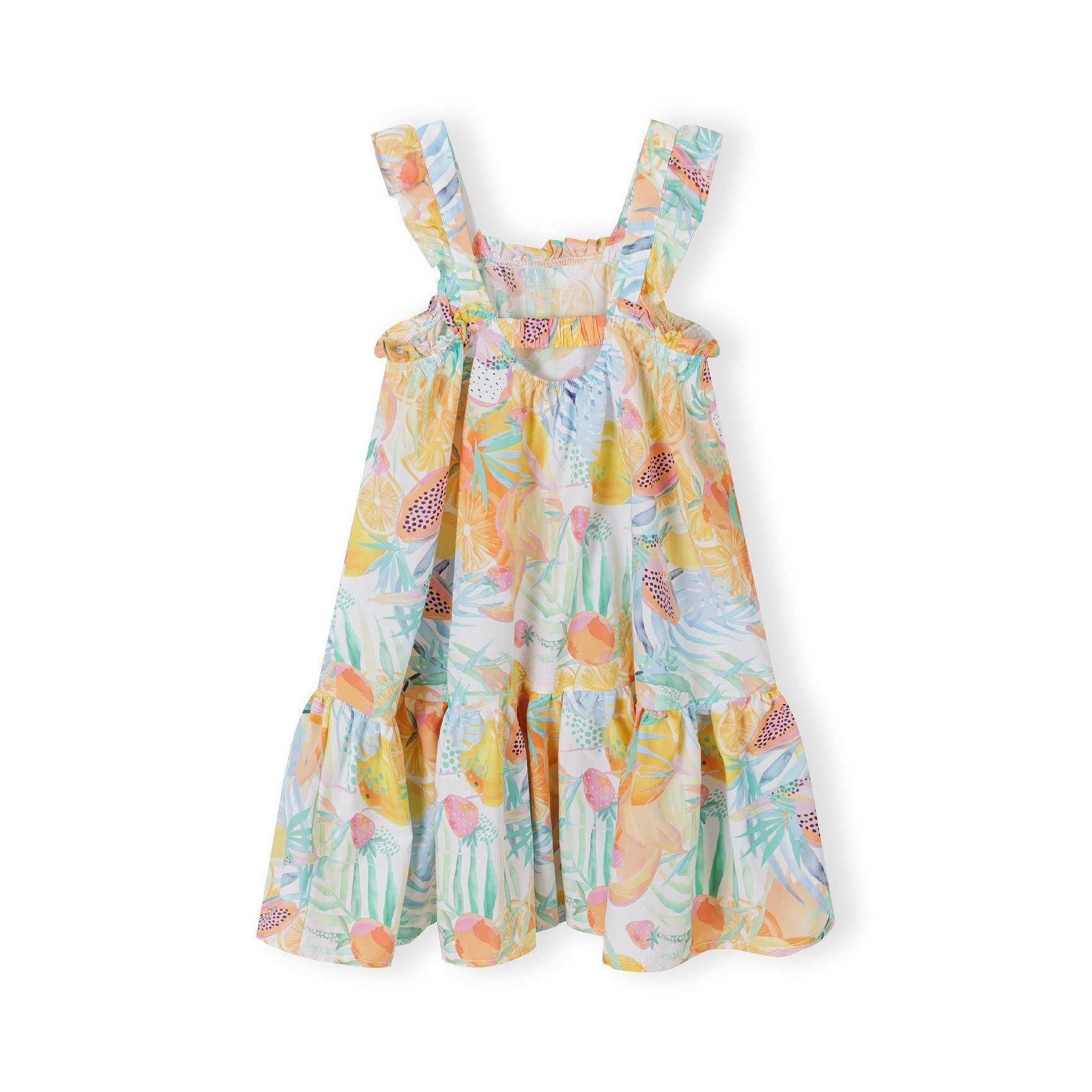 Flat lay of tropical print cotton dress showing tiered ruffle design with shoulder straps against white background