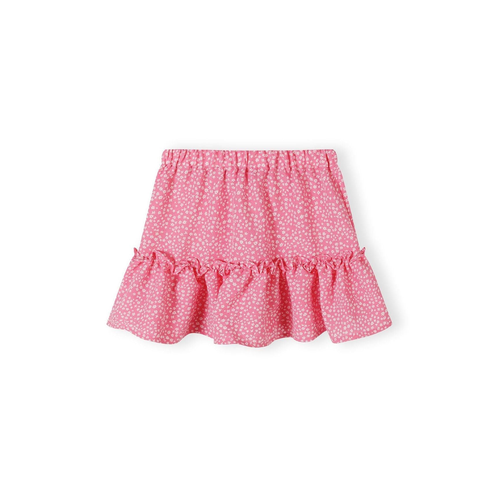 Pink crinkle layered skirt with white floral pattern laid flat showing pleated ruffle hem and elastic waistband on white background