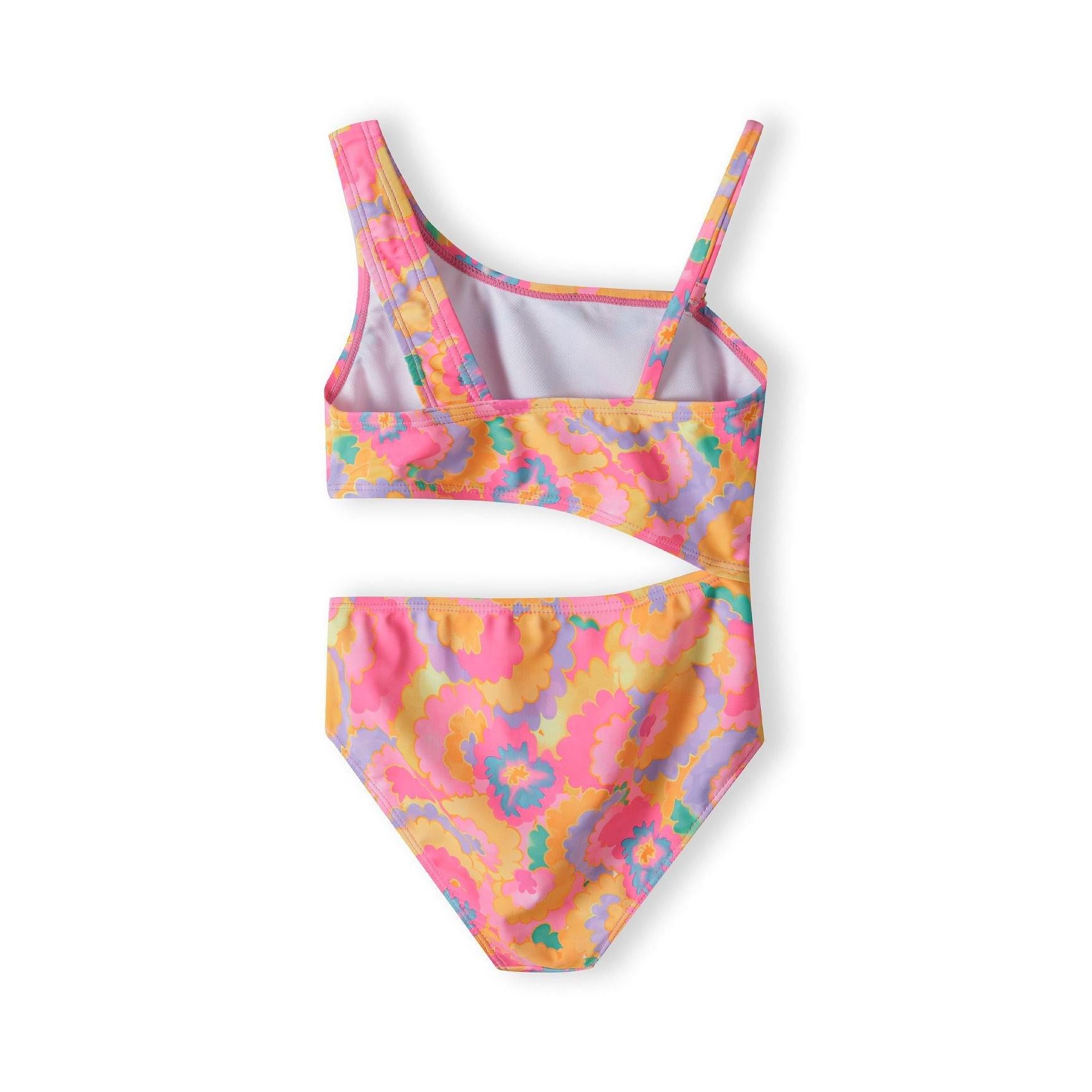 Back view of the multicolor floral cutout bikini showing the asymmetrical back design and matching high-waisted bottoms in bright pink, orange, purple and teal pattern