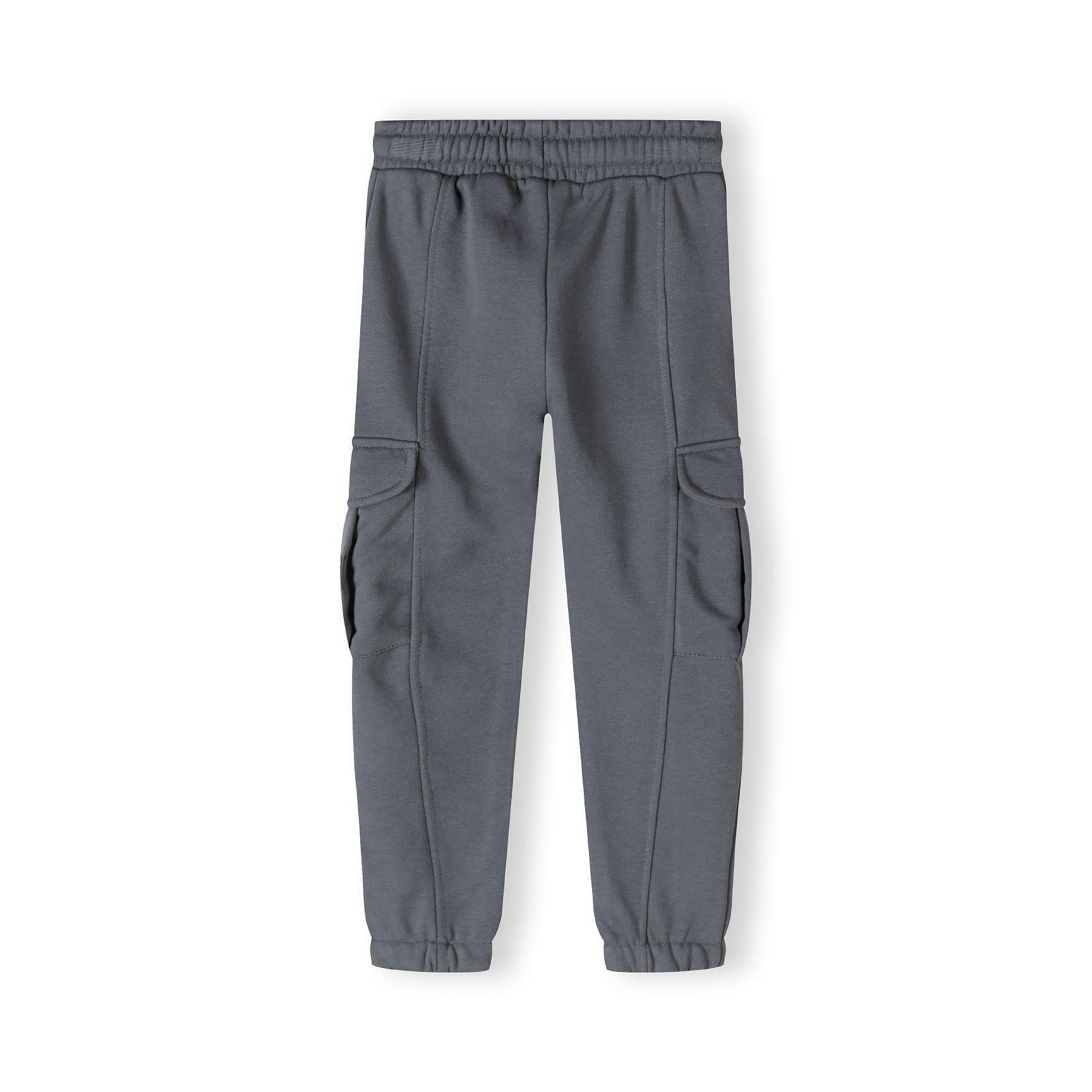 Flat lay view of grey cargo joggers showing side pockets, elasticated waistband and cuffs, full length product shot on white background