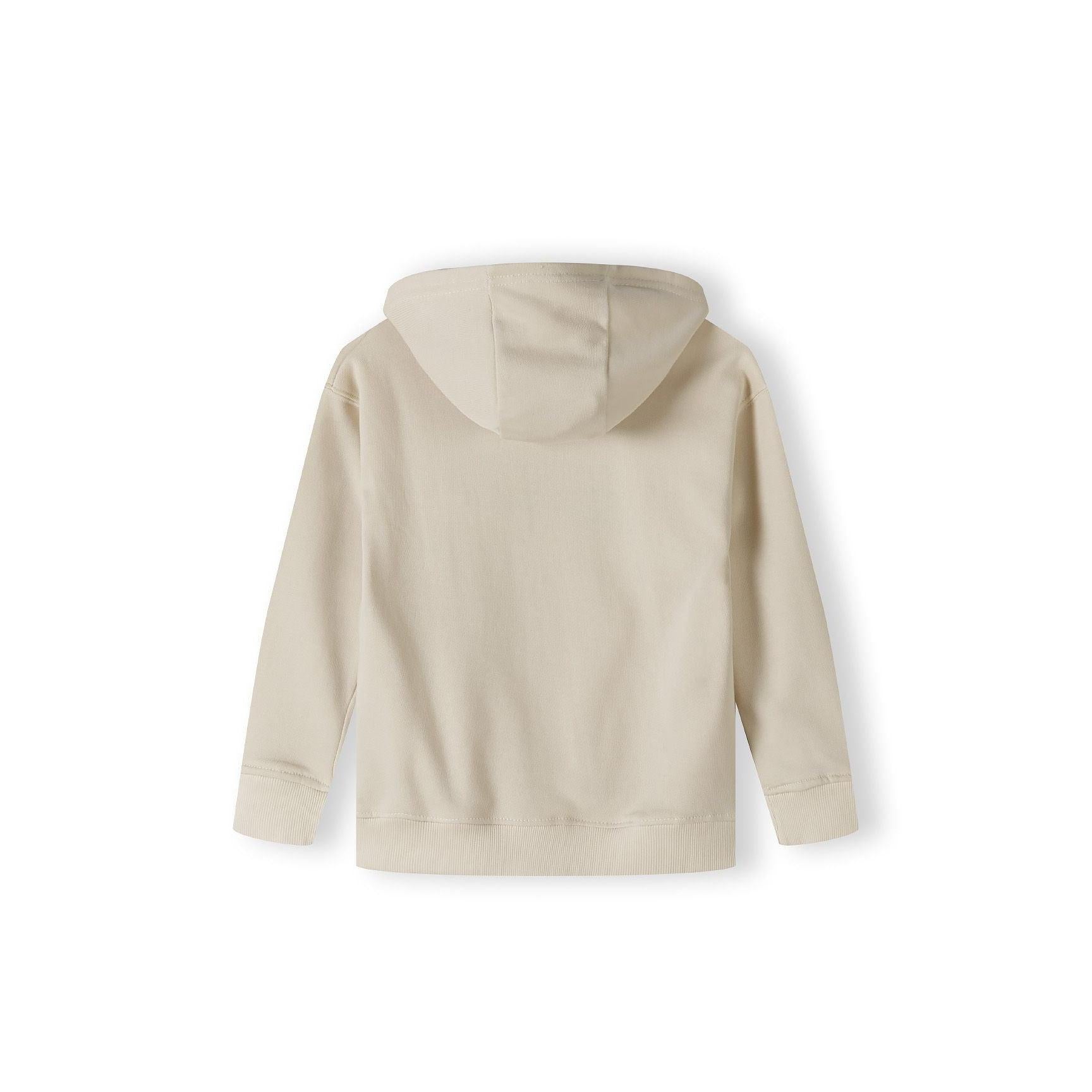 Back view of cream oversized hoodie showing plain design and hood construction