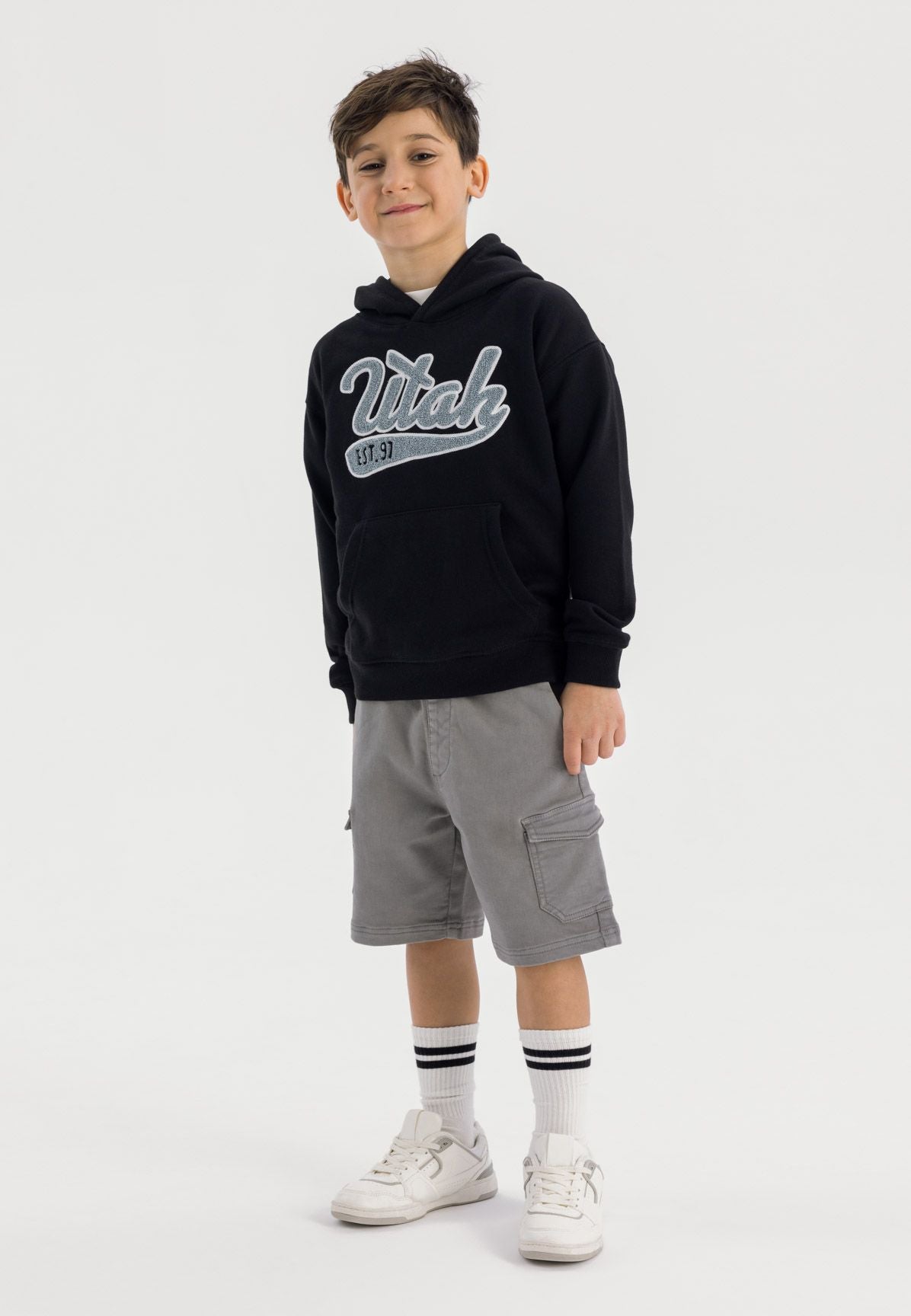 Black pullover hoodie, model front.