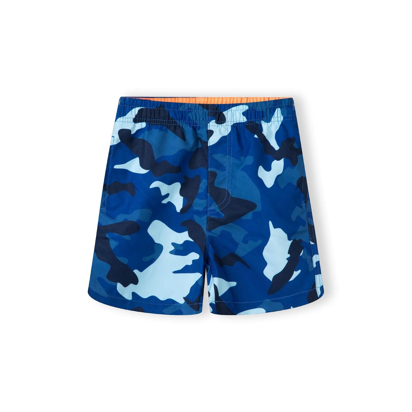Back view of blue camouflage print swim shorts with elastic waistband showing Minoti brand label on white background