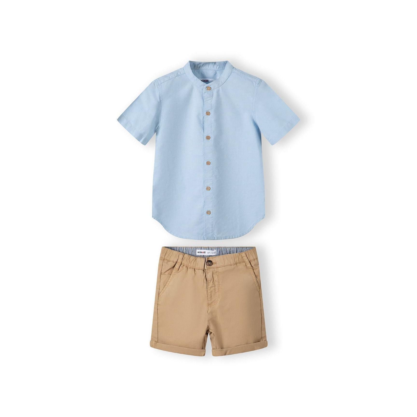 Back view of light blue grandad collar shirt showing button fastening and curved hem design on white background