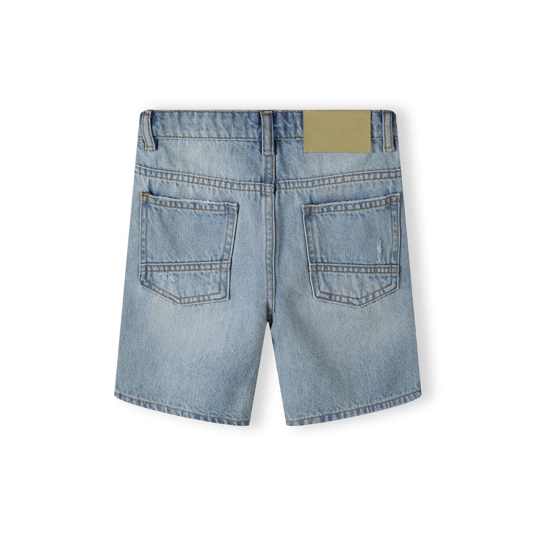 Back view of light blue denim shorts showing five-pocket design and branded leather patch detail