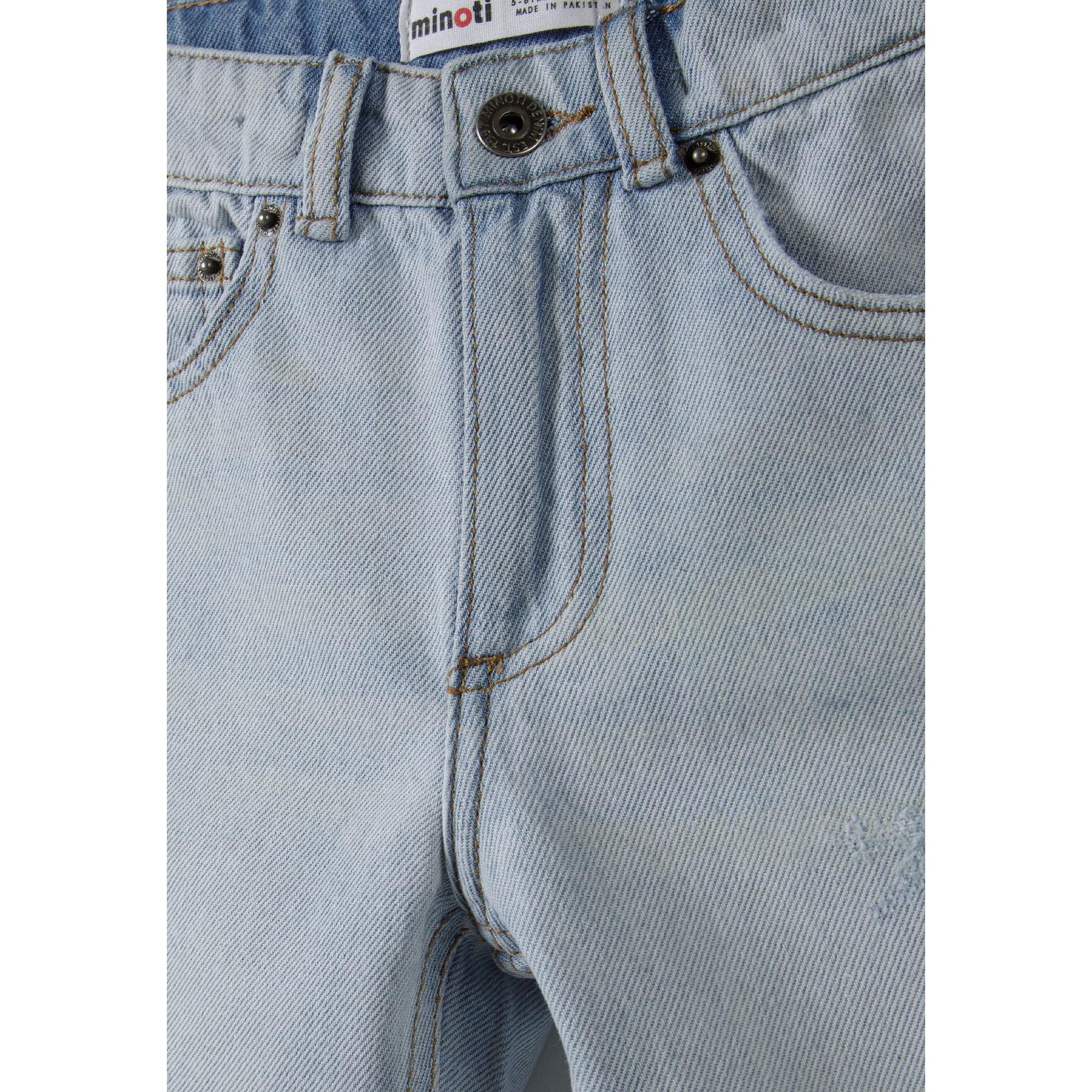 Close-up detail of light blue denim shorts showing Minoti label, button fastening and ripped detailing at front