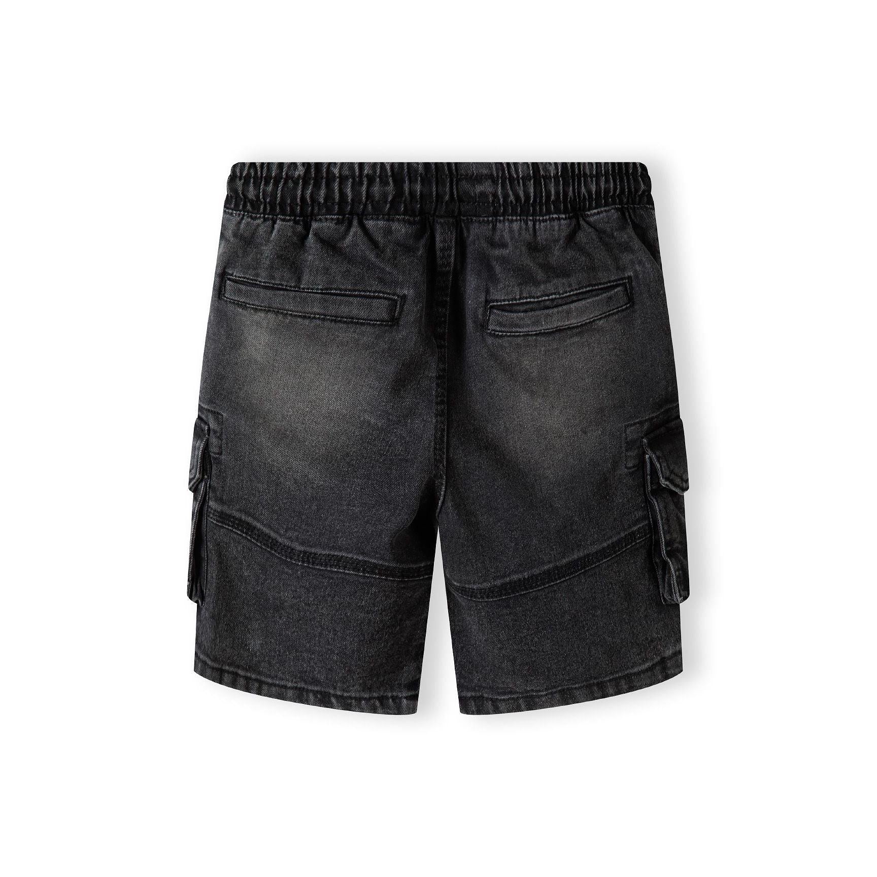 Back view of black denim cargo shorts showing elasticated waistband with drawcord and multiple cargo pockets on white background
