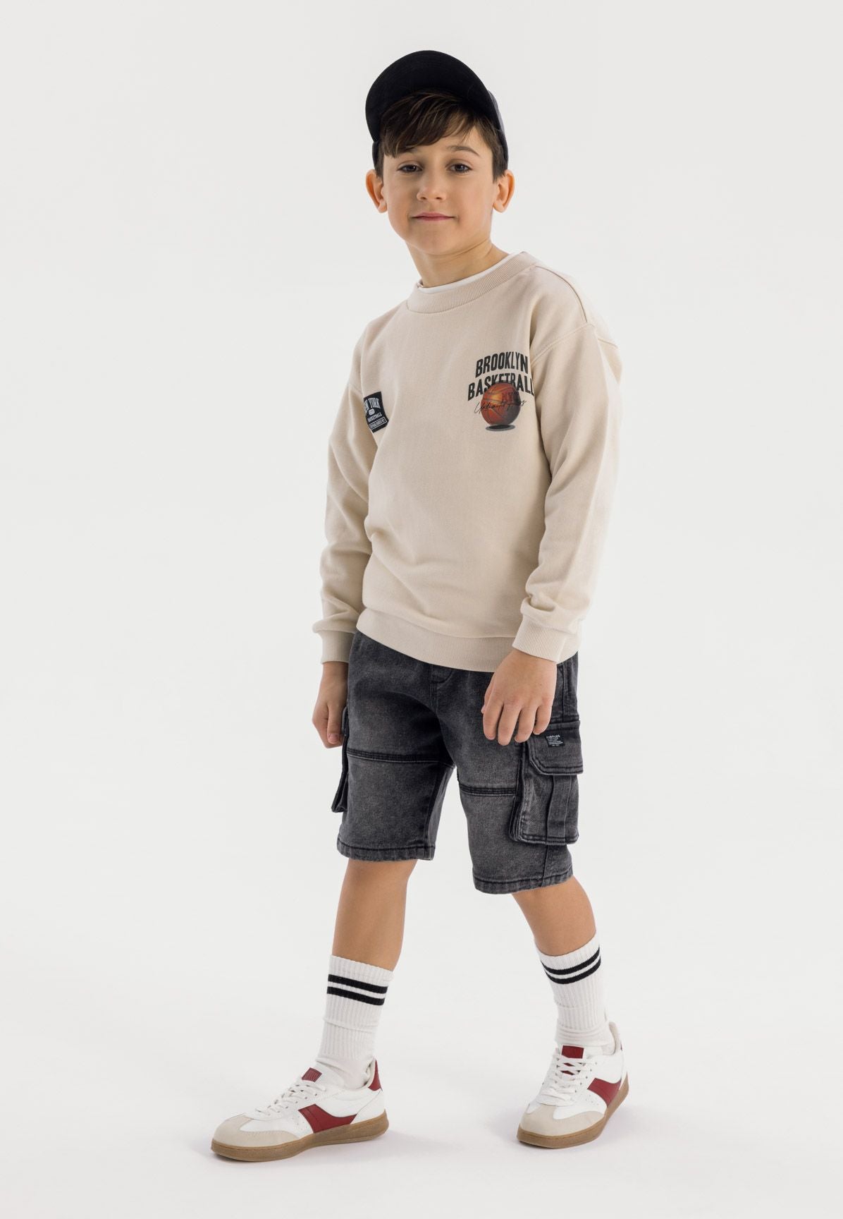 Washed black denim cargo shorts, worn front.