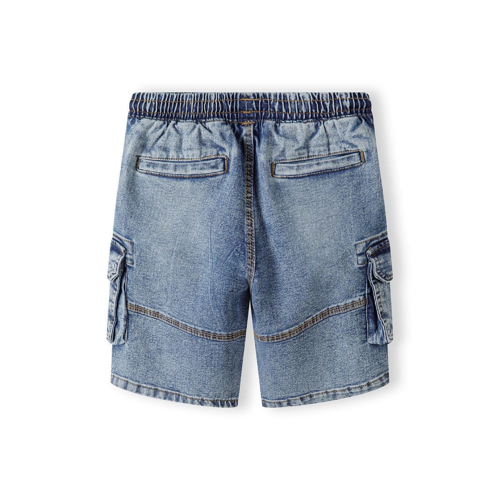 Back view of blue denim cargo shorts showing multiple pockets and elasticated waistband
