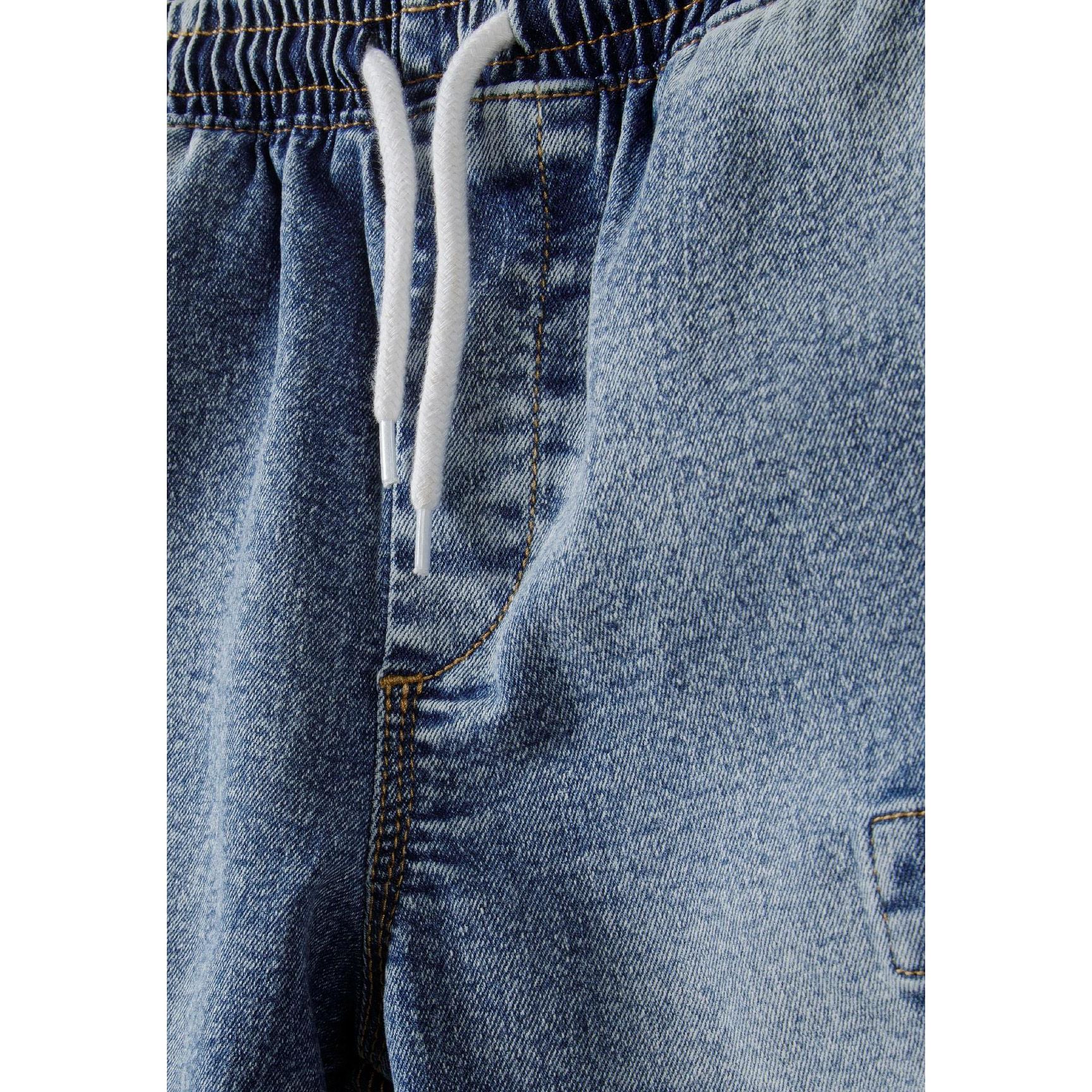 Close-up detail of denim cargo shorts showing drawcord waistband and pocket construction