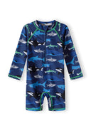 Boys all-in-one rash swimming costume navy 9m-4y featuring shark print. Made from UV-filtered fabric for sun protection and comfort.
