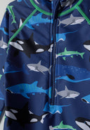 Boys all-in-one rash swimming costume navy 9m-4y with vibrant shark design, UV-filtered and front zip for easy wear.