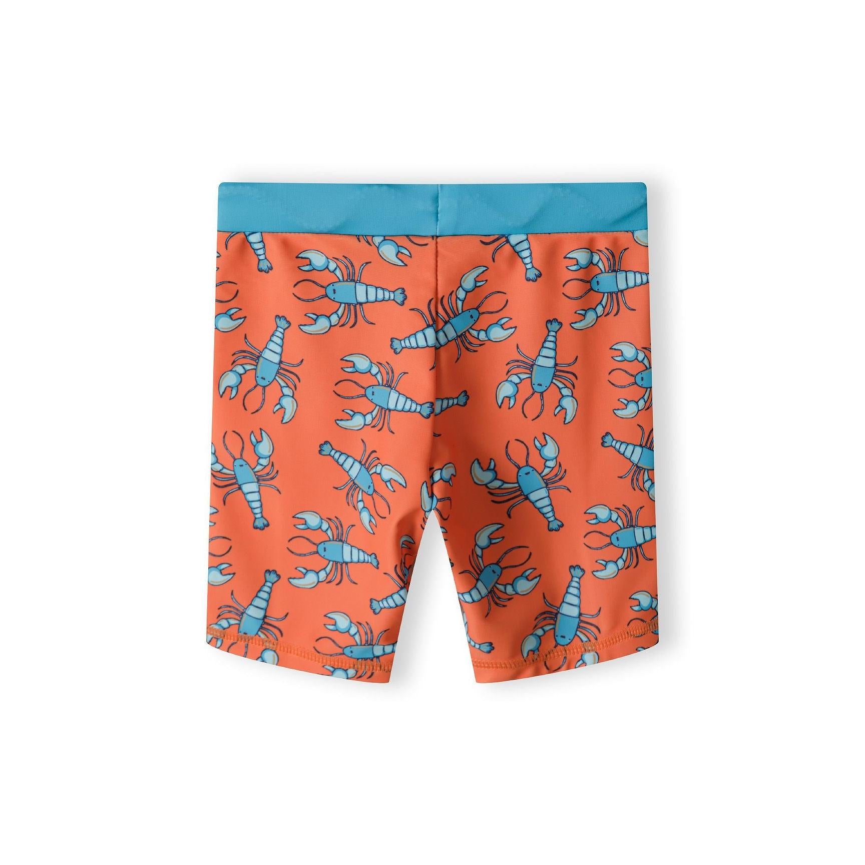 Detail view of navy rashguard top showing orange snorkelling lobster character with diving mask and 'Beach Ready' text with bubble effects