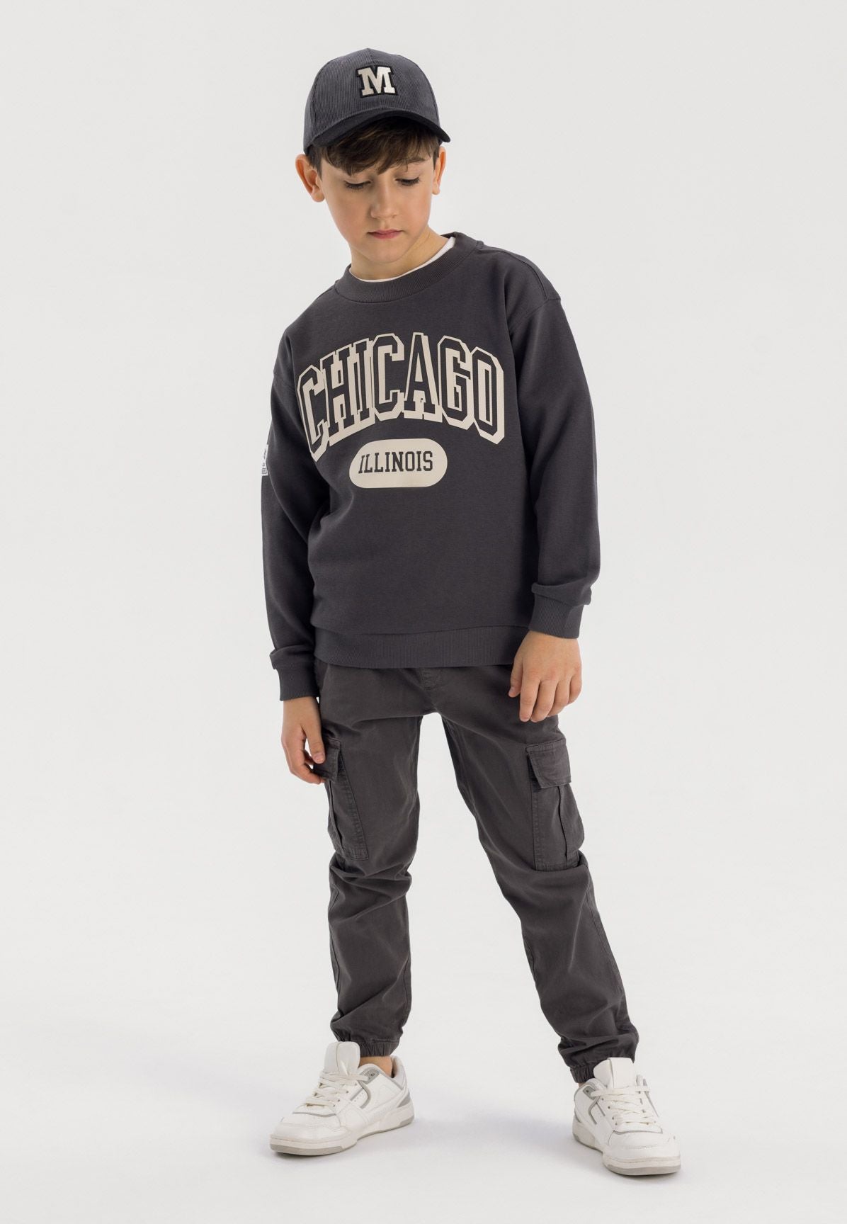Dark grey cargo trousers, trousers worn front.