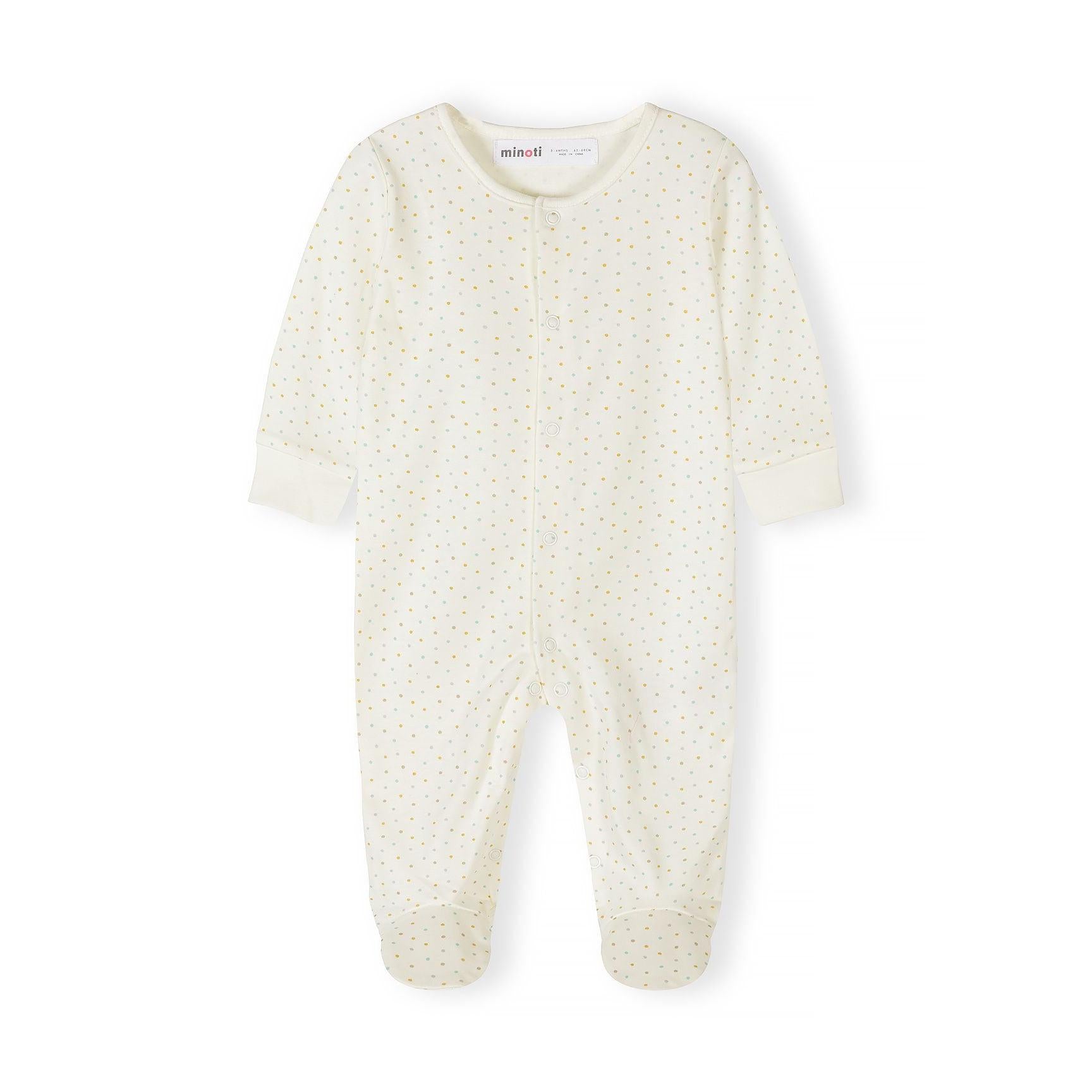 Close-up detail of cream safari print sleepsuit showing colorful animal motifs including elephants, giraffes, lions, crocodiles and palm trees with snap button closure