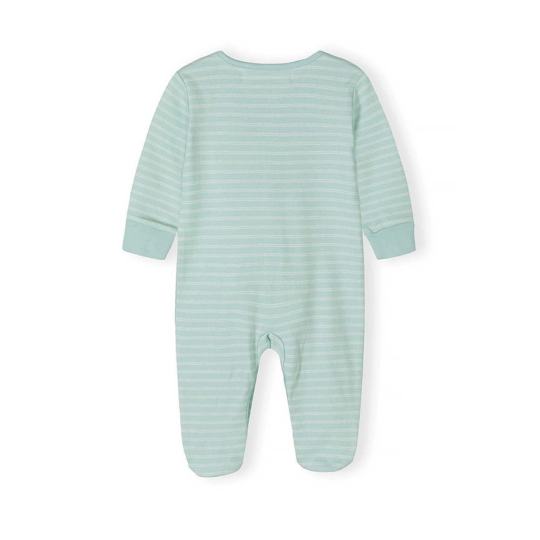 Close-up detail of cream safari print sleepsuit showing colorful animal motifs including elephants, giraffes, lions, crocodiles and palm trees with snap button closure