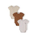 Three ribbed baby bodysuits displayed on white background - cream striped, brown with giraffe print, and beige with small giraffe detail