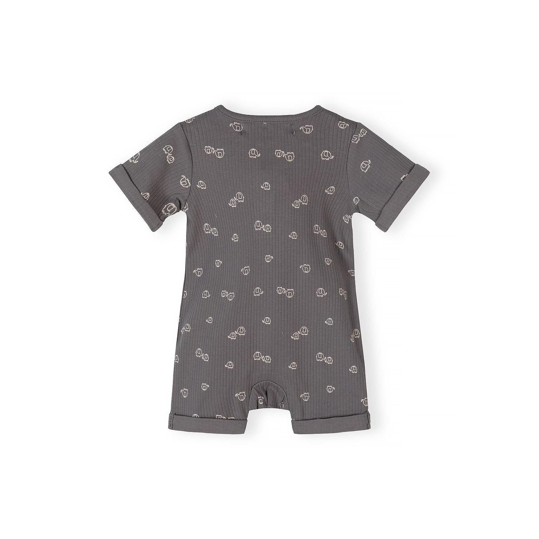 Close-up detail of grey romper showing Minoti label, wooden buttons, elephant print pattern and ribbed cotton texture