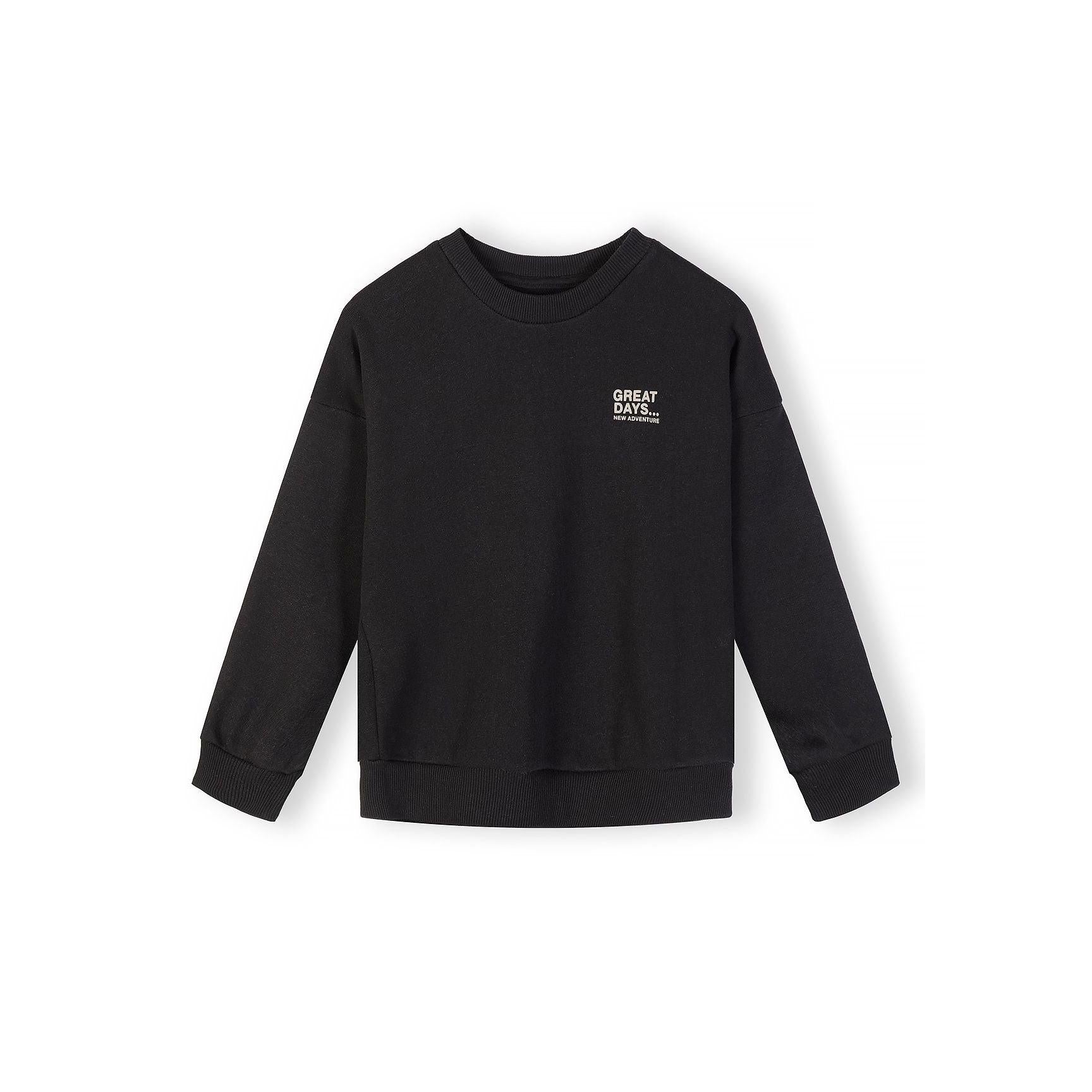 Close-up detail of beige sweatshirt showing Great Days New Adventure text print on chest area