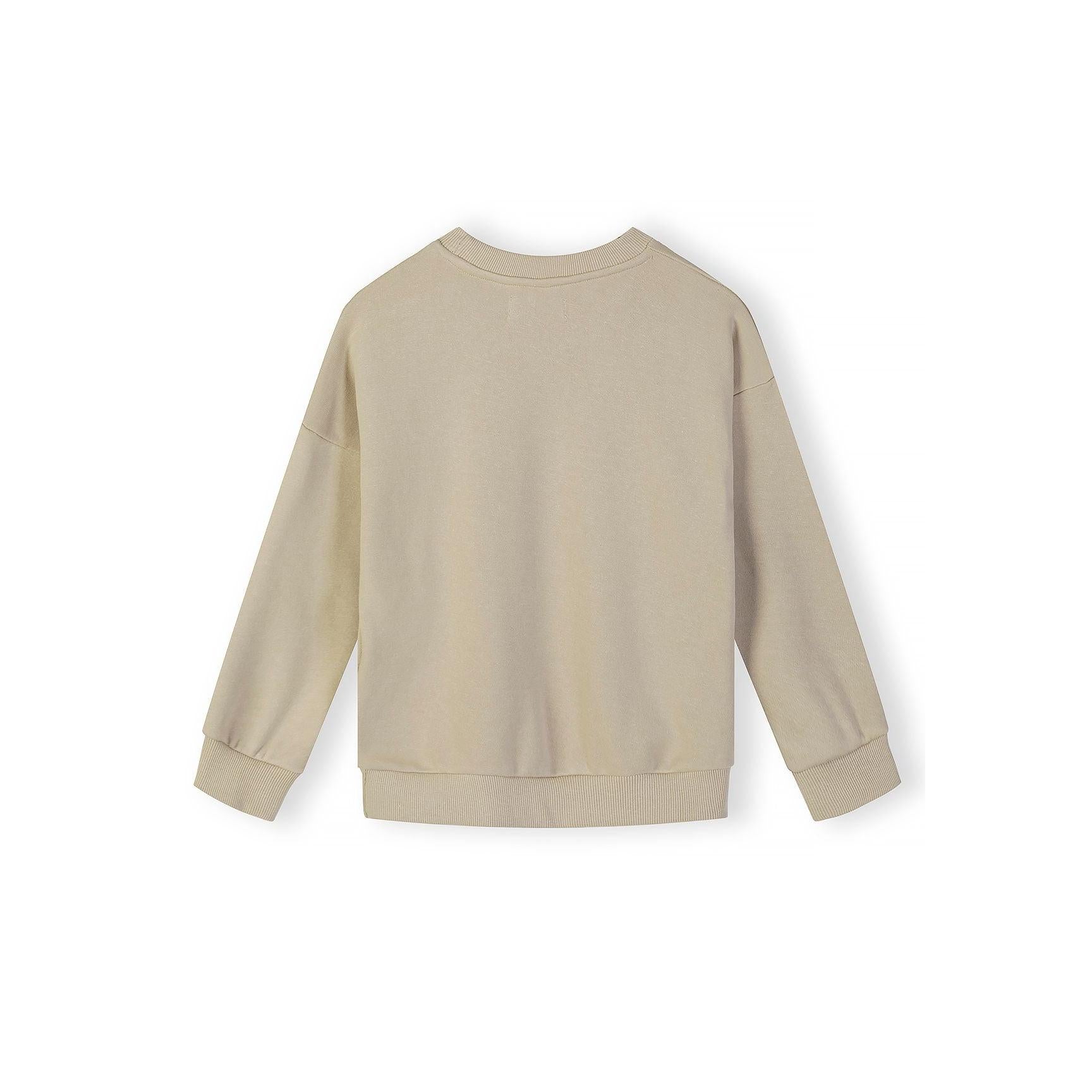 Close-up detail of beige sweatshirt showing Great Days New Adventure text print on chest area