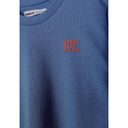 Close-up detail of blue sweatshirt showing Minoti brand label and red 'GREAT DAYS... NEW ADVENTURES' chest print on cotton fabric