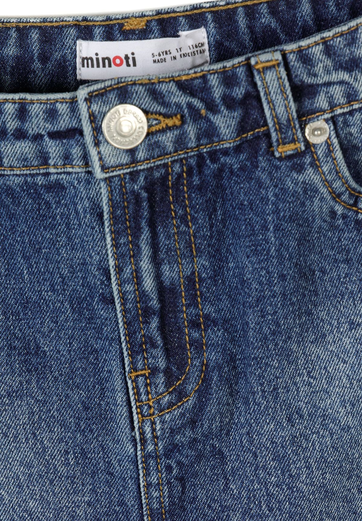 Close-up detail of dark blue denim skirt waistband showing Minoti label, silver button closure and front pocket stitching details