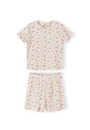 Detail view of pink ribbed fabric texture showing delicate floral print pattern and elastic waistband