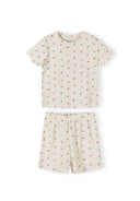 Close-up of pink ribbed pyjama set with small floral print pattern showing top and matching shorts