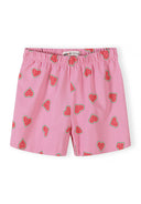 Close-up detail of pink elastic waistband shorts with watermelon heart pattern print, showing Minoti label and fabric texture