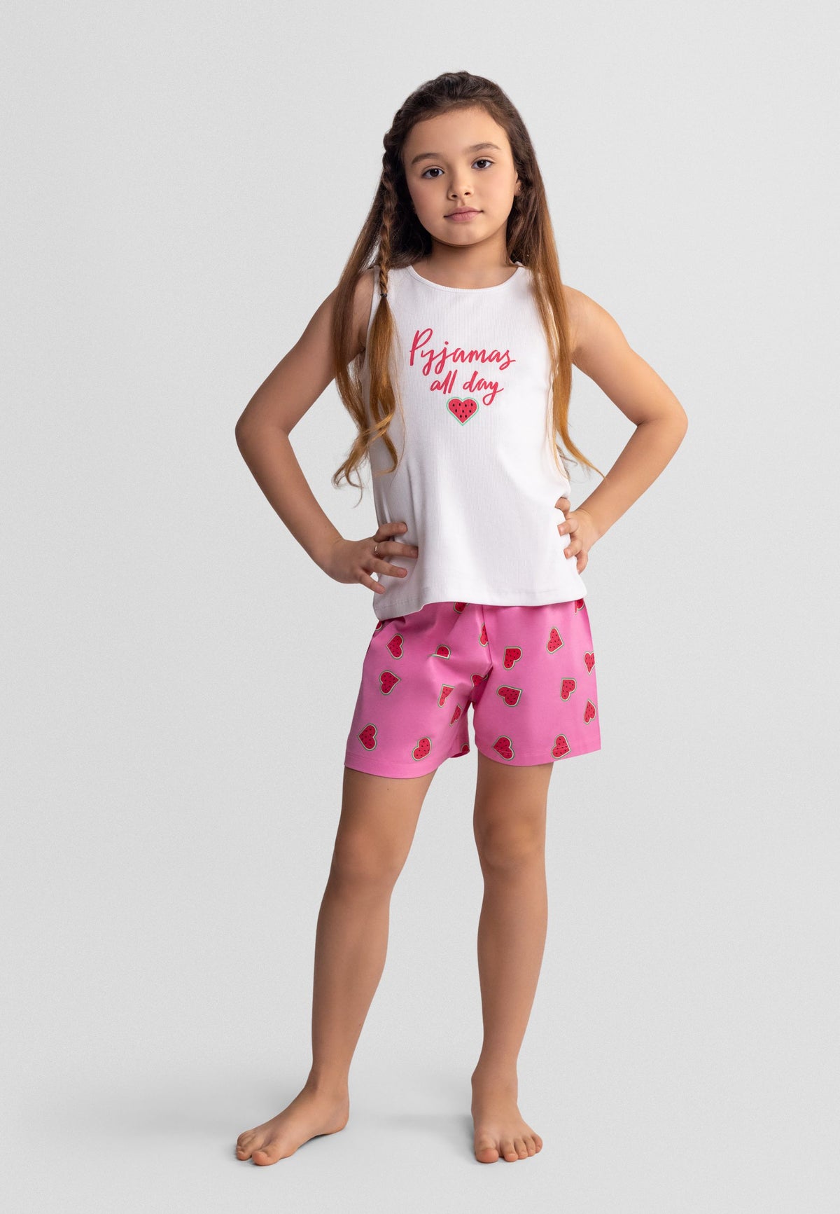 Pink, coral and white vest short pyjamas, model front.