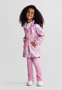 Young girl wearing a stylish shiny pink hooded jacket with drawstring waist and flap pockets smiling confidently