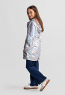 Girl wearing shiny silver hooded jacket with drawstring waist and flap pockets in a stylish kids fashion design