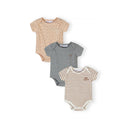 Three ribbed cotton bodysuits displayed on white background - beige with black polka dots, solid grey, and cream with brown stripes featuring 'big smiles' text