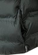 Detail of a boys lightweight hooded jacket with padded insulation and logo badge.