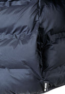 Detail of navy blue lightweight hooded jacket with padding and logo tag.