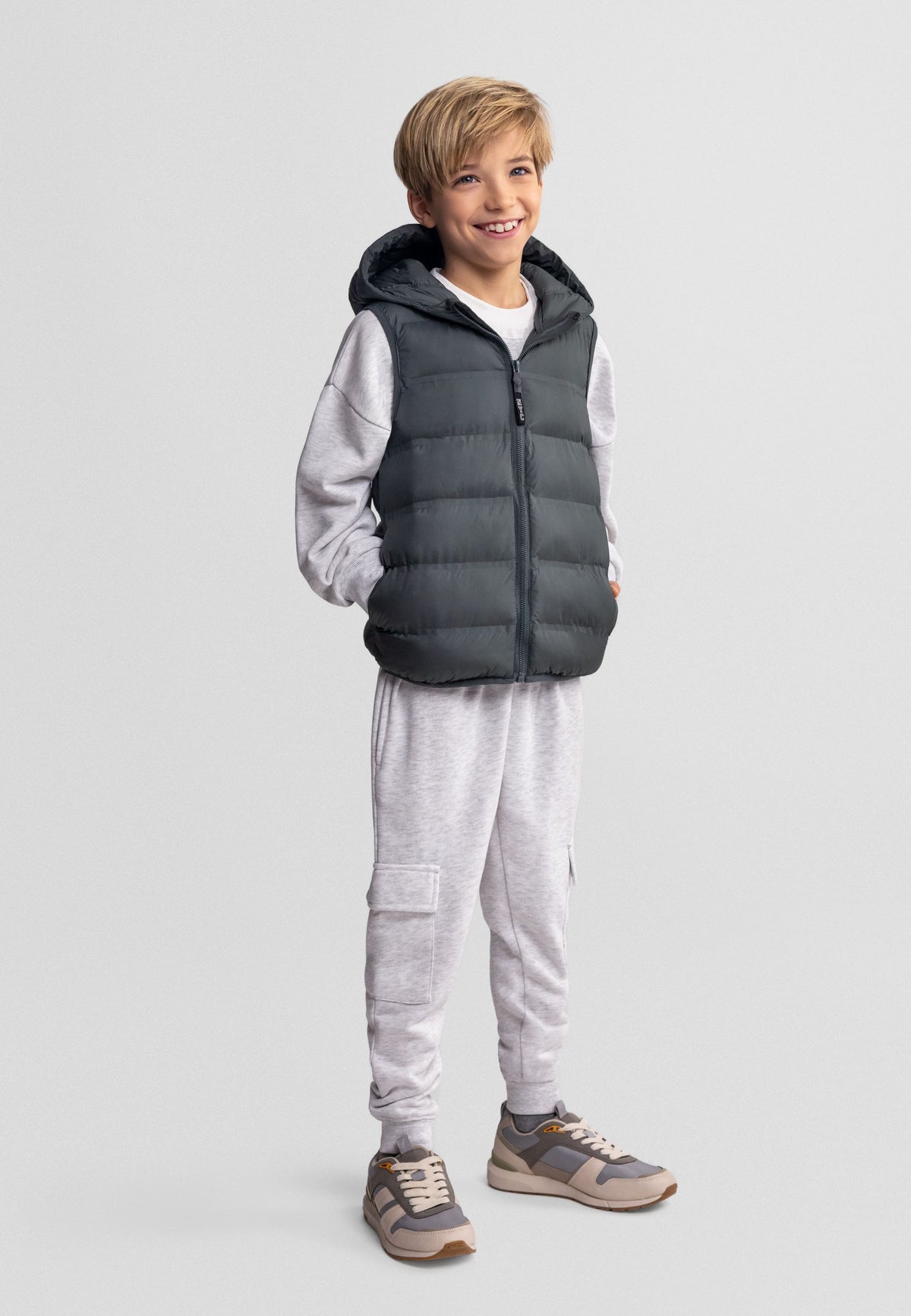 Dark green padded gilet, model front.