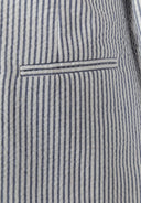 Detail of a boys' navy blue striped tailored blazer with a functional pocket.