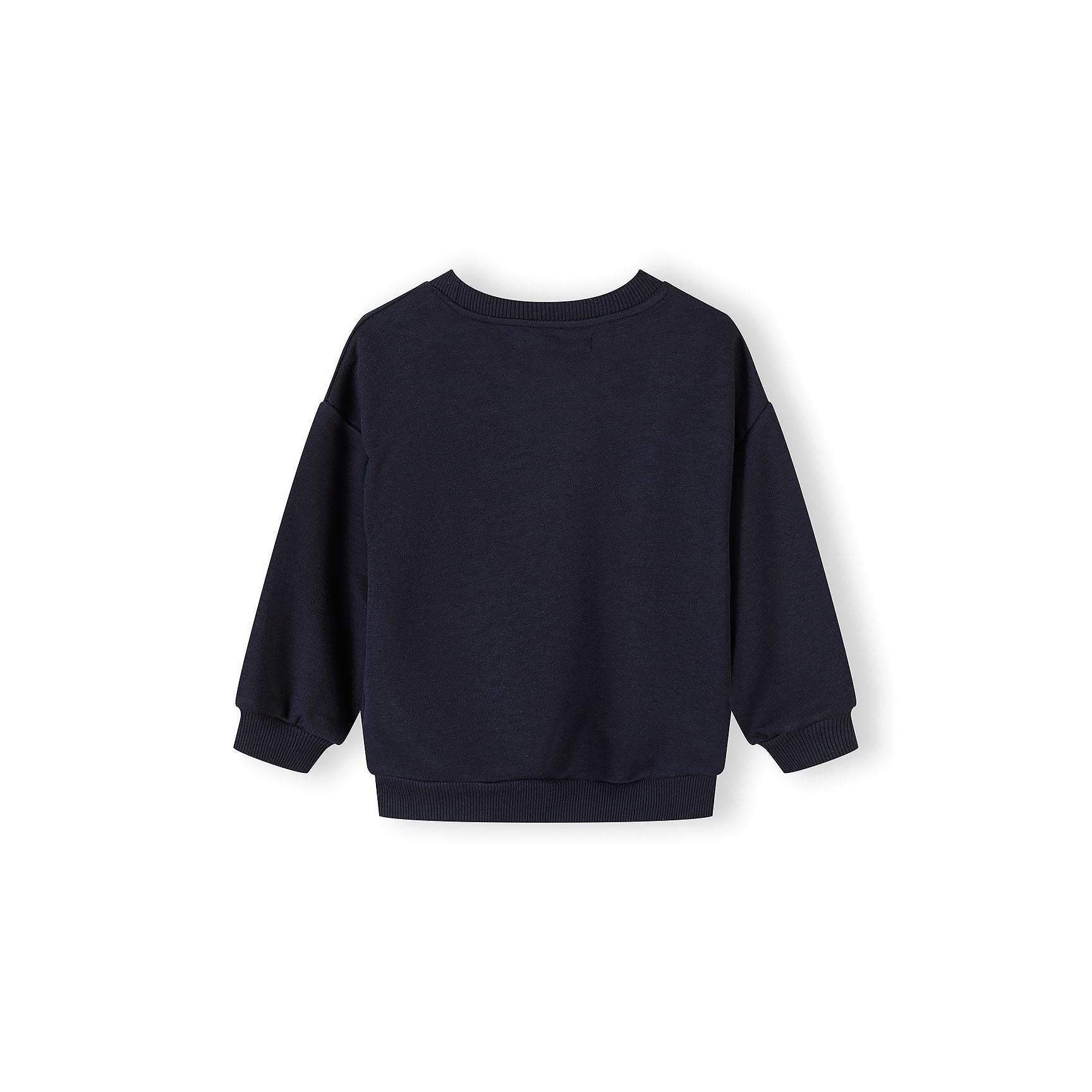 Detail view of white sweatshirt showing 'CALIFORNIA LA SAN DIEGO ATHL STATE' text print with Minoti brand label visible at neckline