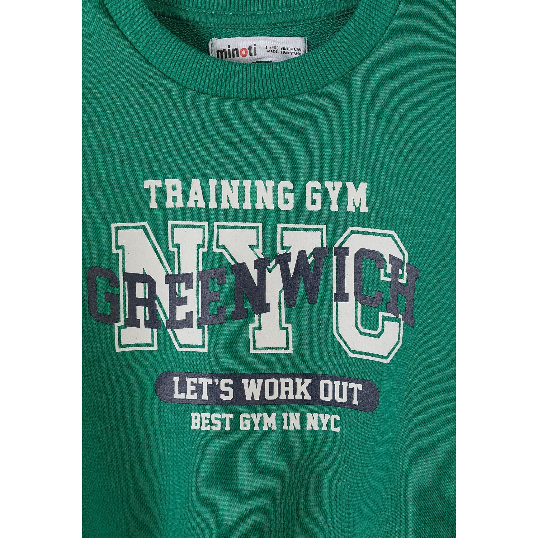 Detail view of cream sweatshirt featuring Fun Days text with Always script overlay and Minoti brand label visible at neckline