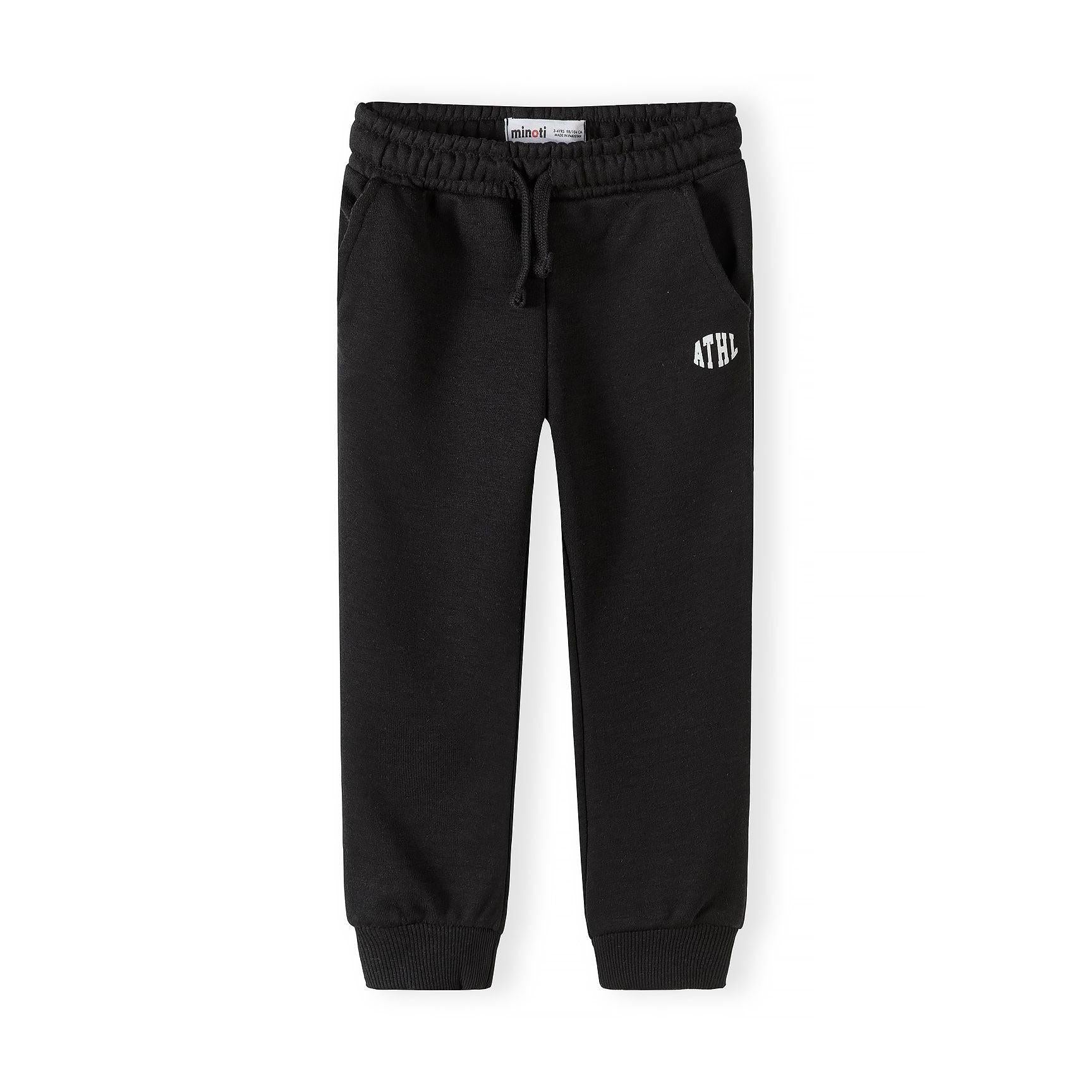 Single black Minoti joggers with Minoti label visible, showing drawstring waist and ATHL logo placement on white background