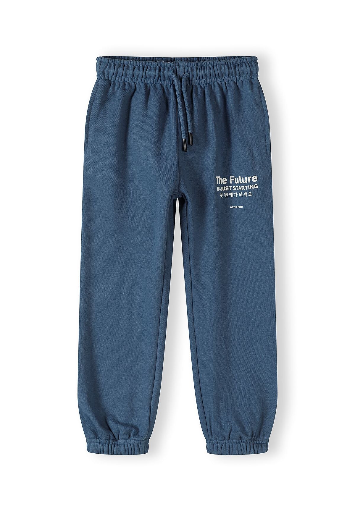 Boys blue jogger trousers with elasticated waistband and printed text, front view.