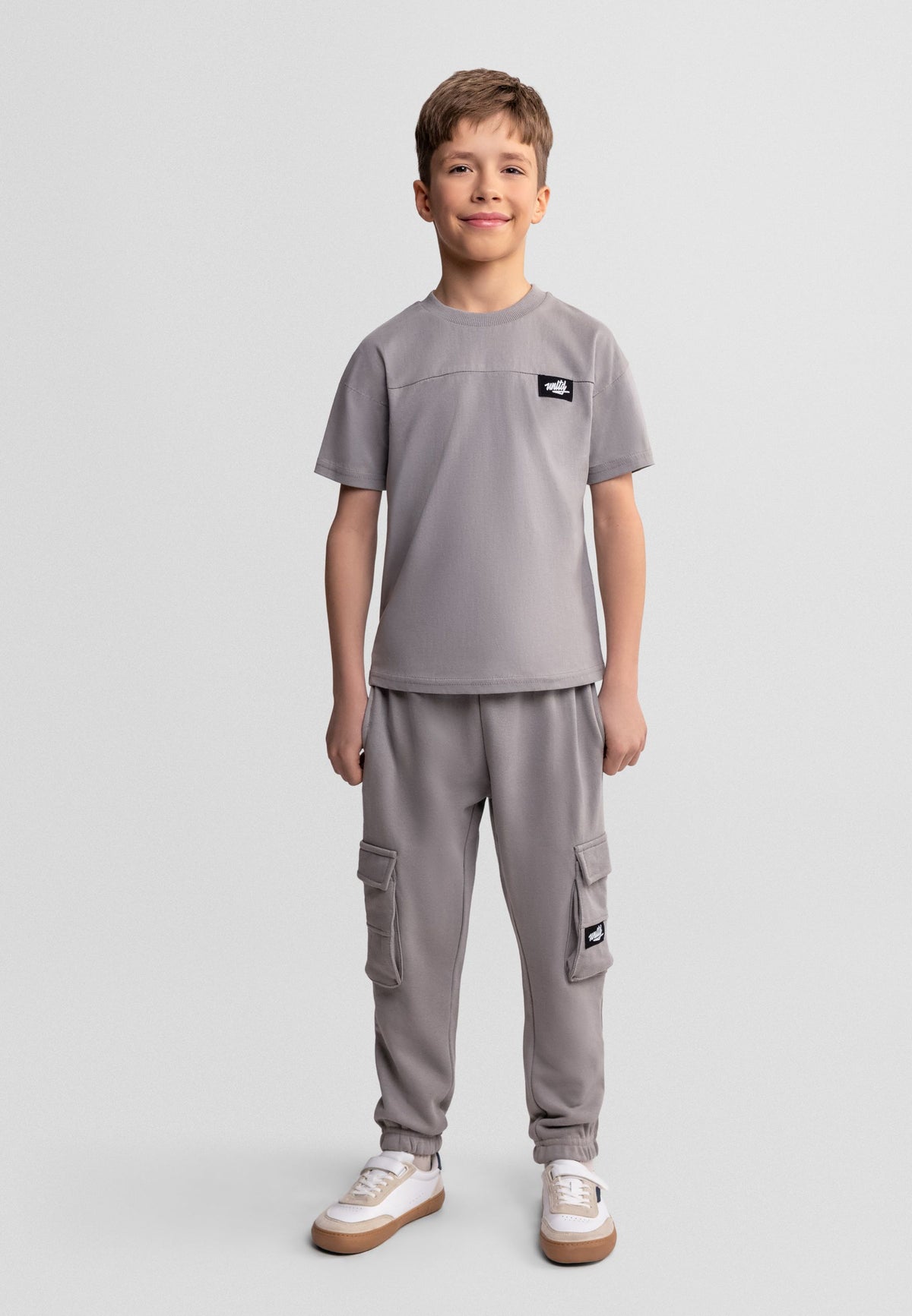 Grey t-shirt and cargo joggers set, model front.