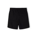 Close-up front view of black t-shirt showing detailed The Future is Now circular white text print with Japanese characters below