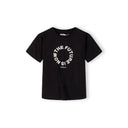 Close-up front view of black t-shirt showing detailed The Future is Now circular white text print with Japanese characters below