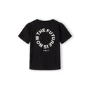 Back view of black t-shirt showing The Future is Now circular print design with Japanese characters underneath on white background