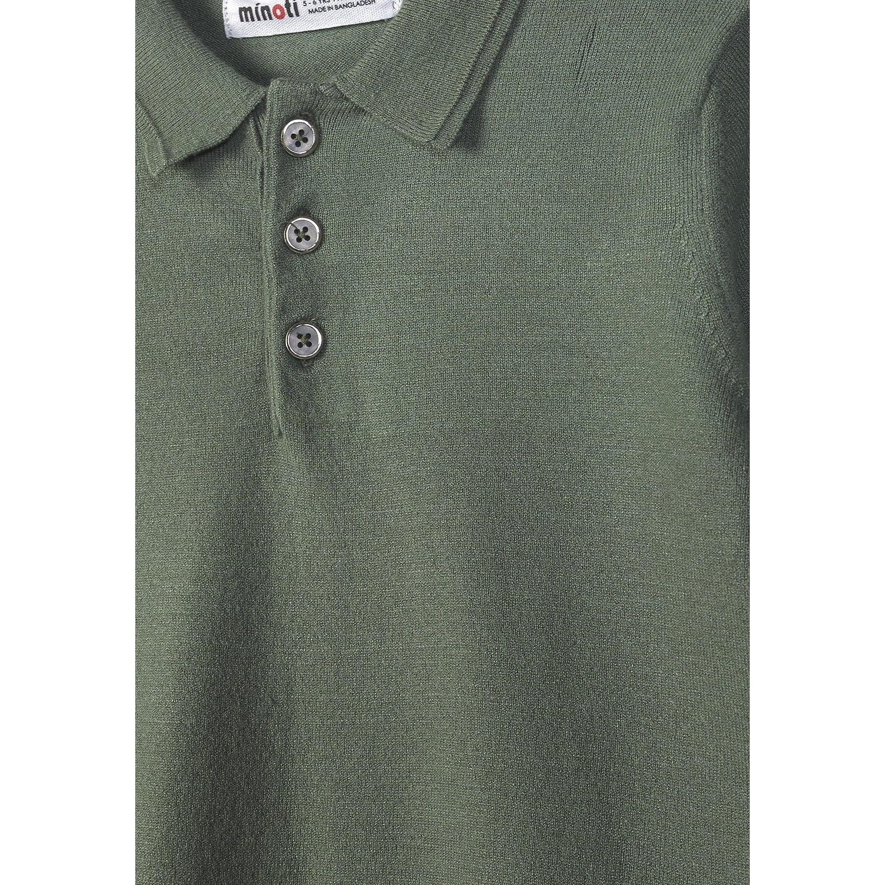 Close-up detail of forest green polo shirt showing Minoti label, collar and three-button placket with texture detail