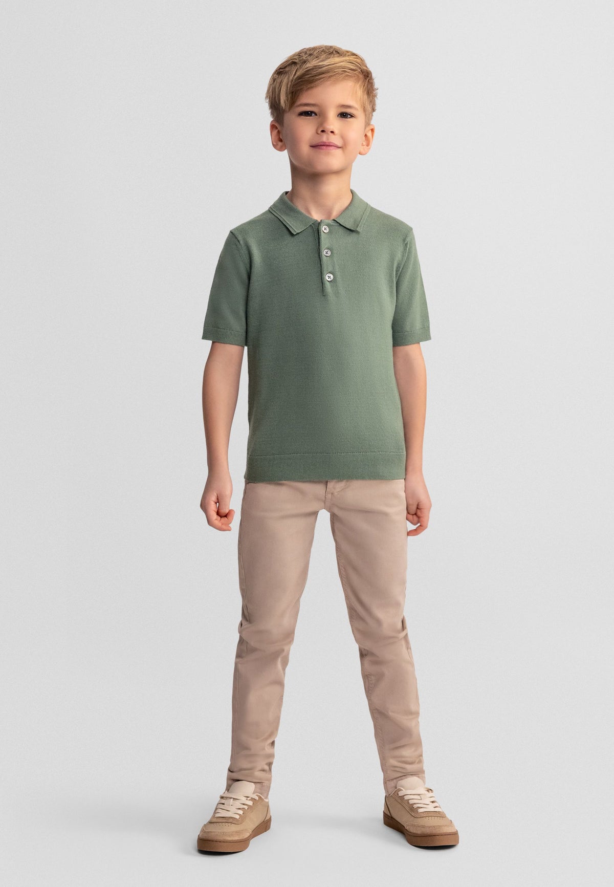 Olive green knitted polo shirt, model front.