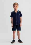 Boys navy blue knitted polo shirt and shorts set, front view, features collar and chest pocket.