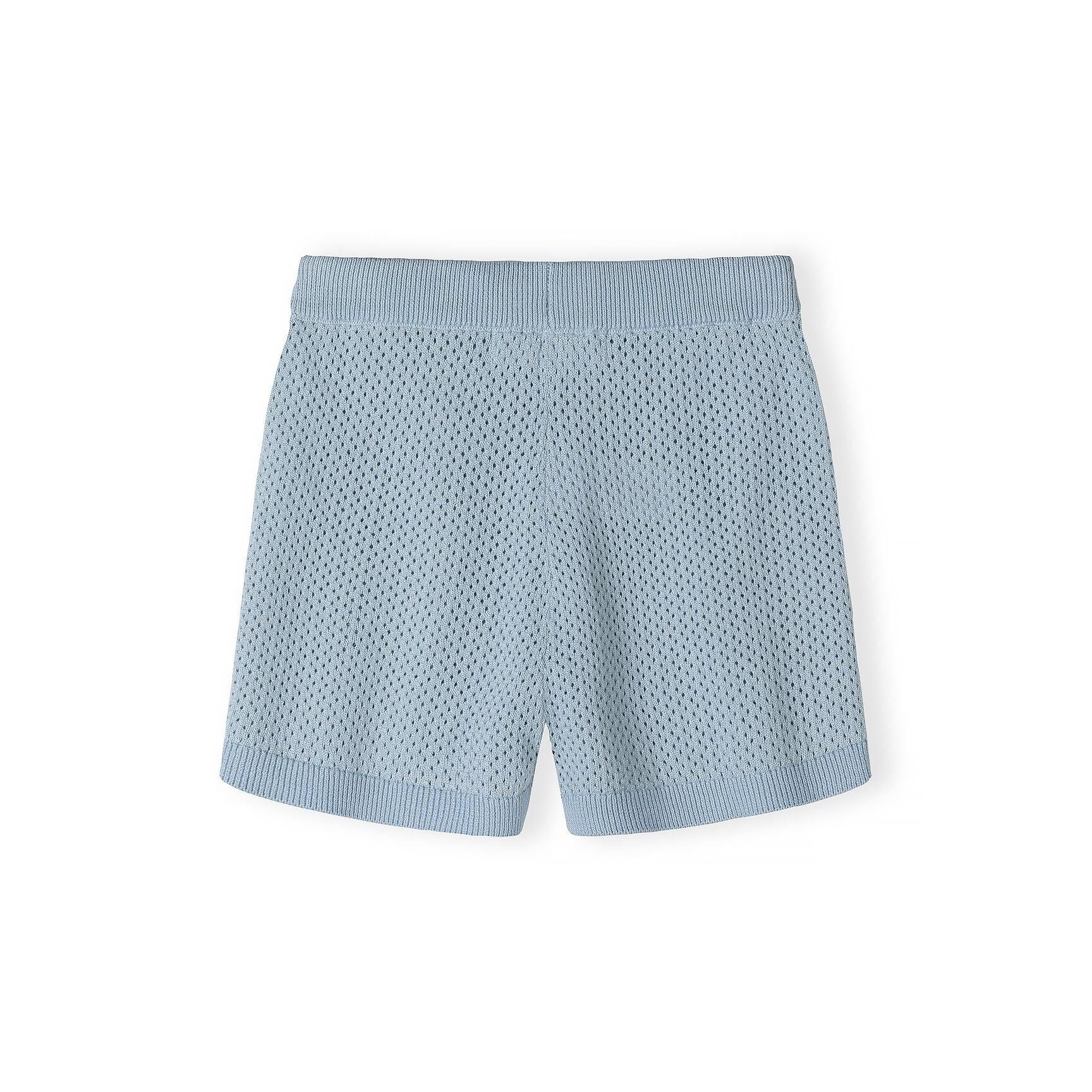 Close-up detail of light blue knitted shorts showing mesh texture, elasticated waistband with drawstring ties