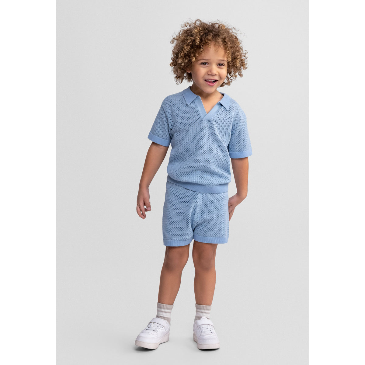 Boys' knitted polo and shorts set in light blue — complete product view for square Shop card